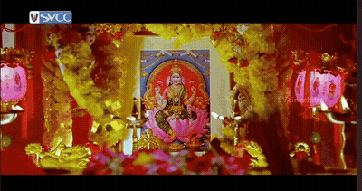 A Picture Of A Woman On A Lotus Flower Is Surrounded By Flowers And A Sign That Says Svcc On It GIF