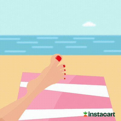 A Picture Of A Woman 'S Foot On A Beach Towel With The Words Summer 'S Here Below It GIF