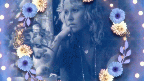 A Picture Of A Woman Surrounded By Blue And Yellow Flowers With The Word Mer On The Bottom GIF