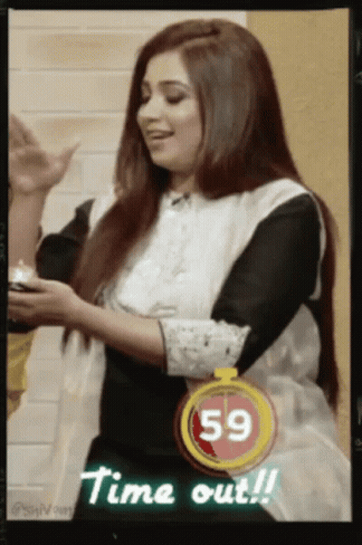 A Picture Of A Woman With A 59 Second Timer Behind Her GIF