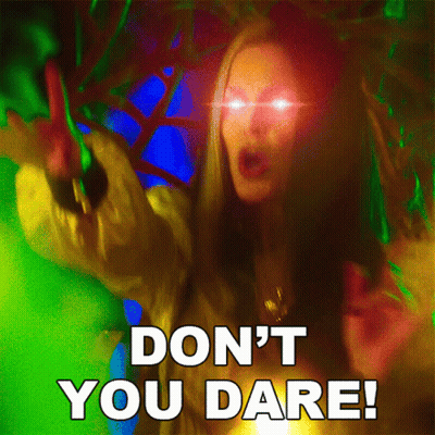 A Picture Of A Woman With Glowing Eyes And The Words " Don 'T You Dare " GIF