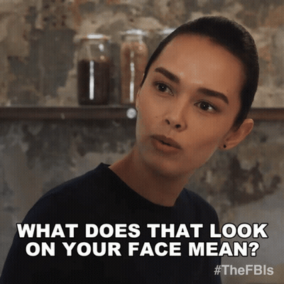 A Picture Of A Woman With The Caption What Does That Look On Your Face Mean GIF