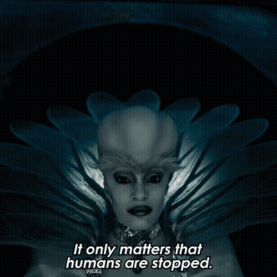 A Picture Of A Woman With The Words " It Only Matters That Humans Are Stopped " Below Her GIF