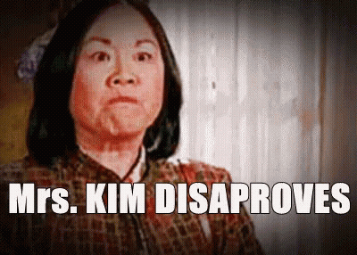 A Picture Of A Woman With The Words Mrs. Kim Disaproves Above Her GIF
