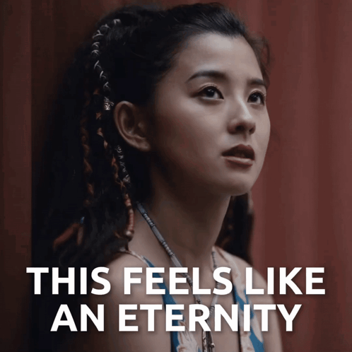 A Picture Of A Woman With The Words " This Feels Like An Eternity " Below Her GIF