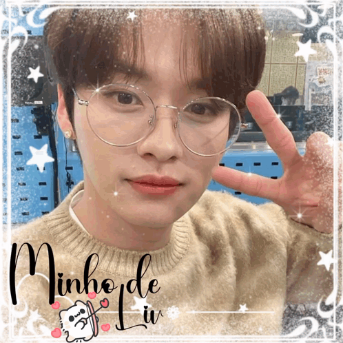 A Picture Of A Young Man With Glasses And The Name Minho GIF