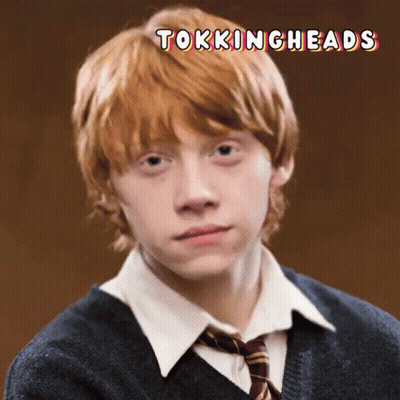 a picture of a young man with red hair and the words tokingheads above him