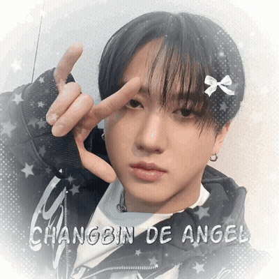 A Picture Of A Young Man With The Name Changbin De Angel On The Bottom GIF