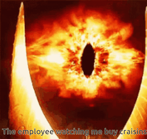 A Picture Of An Eye With The Words The Employee Watching Me Buy Raisins GIF