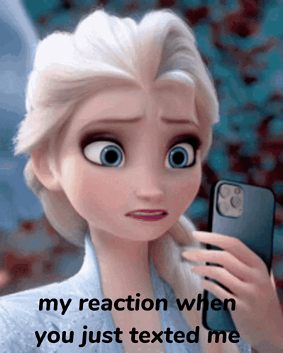 A Picture Of Elsa From Frozen Holding A Cell Phone With The Caption " My Reaction When You Just Texted Me " GIF