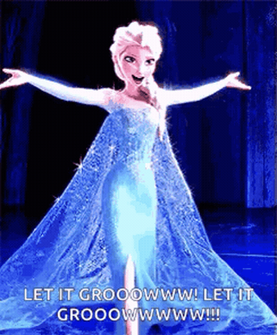 A Picture Of Elsa From The Movie Frozen With Her Arms Outstretched GIF