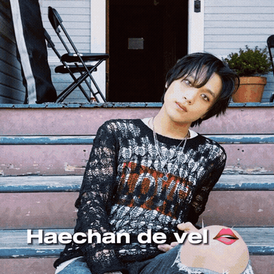 A Picture Of Haechan De Vel Sitting On The Steps GIF