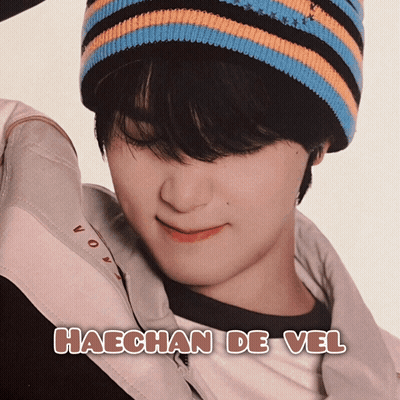 A Picture Of Haechan De Vel With A Striped Hat On GIF