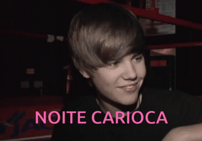 A Picture Of Justin Bieber With The Words Noite Carioca In Pink GIF