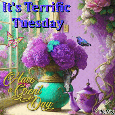 A Picture Of Purple Flowers In A Vase With The Words It 'S Terrific Tuesday GIF