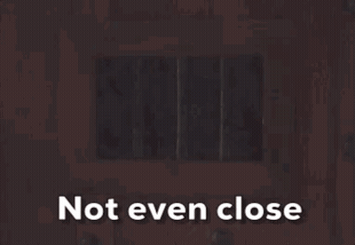 A Picture Of Santa Claus Behind Bars With The Words Not Even Close Above Him GIF