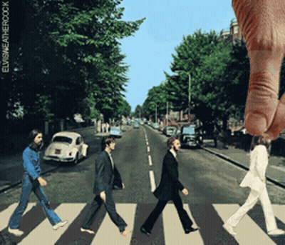 A Picture Of The Beatles Walking Across A Crosswalk With A Hand Reaching Out Towards Them GIF