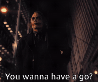 A Picture Of The Joker With The Words " You Wanna Have A Go " Below Him GIF