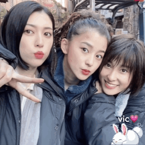 A Picture Of Three Girls With The Word Vic On The Bottom Right GIF
