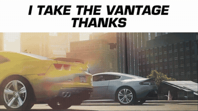 A Picture Of Two Cars With The Words " I Take The Vantage Thanks " At The Top GIF