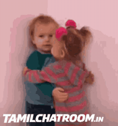 A Picture Of Two Children Hugging With Tamilchatroom.in In The Bottom Right Corner GIF