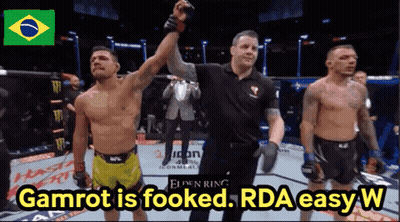 A Picture Of Two Men In A Ring With The Words Gamrot Is Fooked Rda Easy W GIF