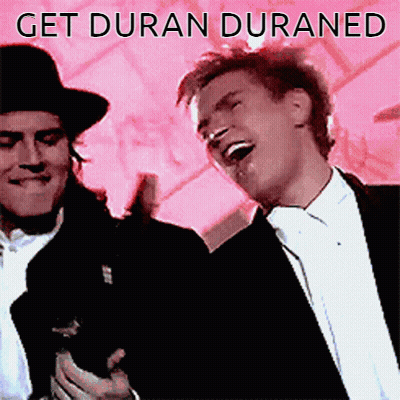 A Picture Of Two Men With The Words Get Duran Duraned GIF
