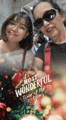 A Picture Of Two Women With The Words It 'S The Most Wonderful Time Of The Year On It GIF