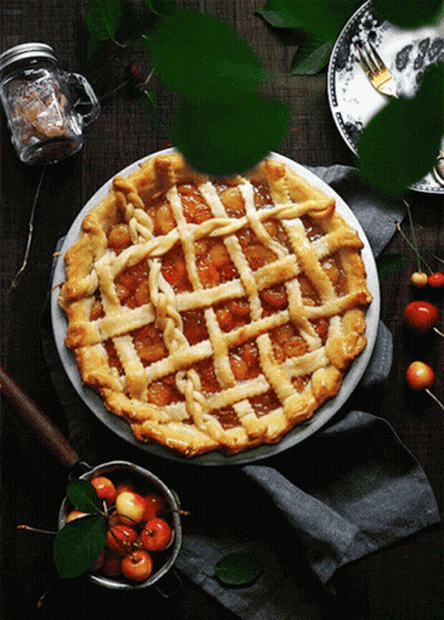 A Pie With A Lattice Crust Sits On A White Plate GIF