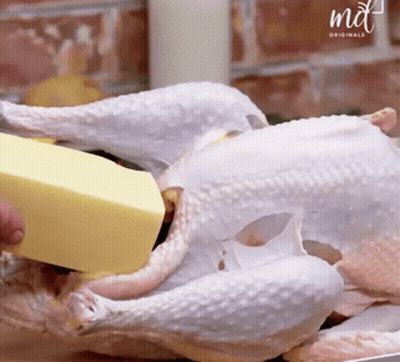 A Piece Of Butter Is Being Poured On A Chicken By A Md Originals Logo GIF