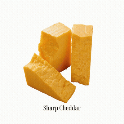 A Piece Of Honey Goat Gouda Is Shown On A White Background GIF