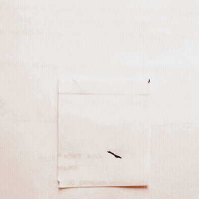 A Piece Of Paper With The Letter M Written In Black Marker GIF