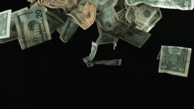 A Pile Of 20 Dollar Bills Falling On A Black Surface GIF
