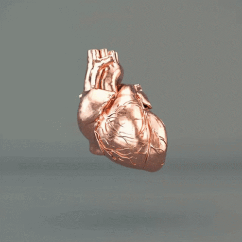 A Pile Of Copper Pieces Flying In The Air On A Gray Background GIF