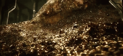 A Pile Of Gold Coins And Rocks In A Cave . GIF
