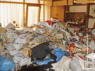 A Pile Of Trash In A Room With A Sign That Says Trendizisst On It GIF