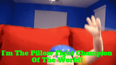 A Pillow Fight Champion Is Sitting On A Couch GIF