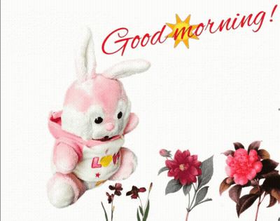 A Pink And White Stuffed Bunny With The Words Good Morning On It GIF