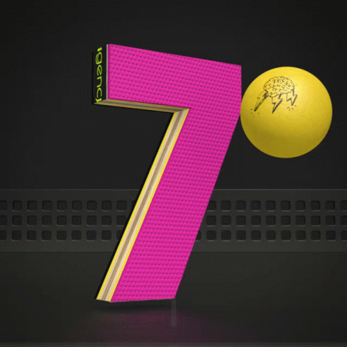 A Pink And Yellow Number 7 With A Yellow Ball In Front Of It GIF