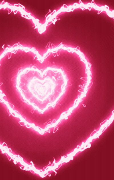 A Pink Background With A Glowing Heart Shaped Pattern GIF