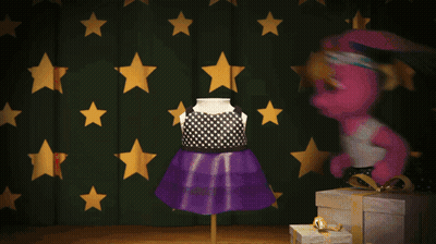A Pink Bunny Doll Is Standing In Front Of A Green Curtain With Gold Stars GIF