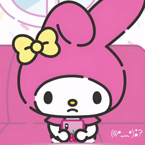 A Pink Bunny With A Yellow Bow Is Sitting On A Couch GIF