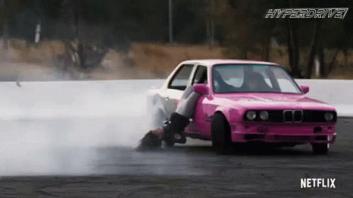 A Pink Car With A Netflix Logo On The Bottom Of It GIF
