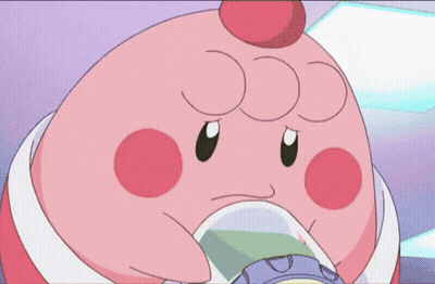 A Pink Cartoon Character With A White Egg In Its Mouth Is Smiling GIF