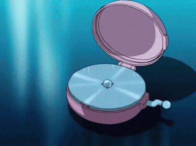 A Pink Clock With A Blue Disc Inside Of It GIF