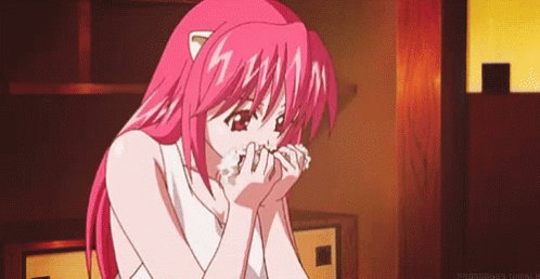 A Pink Haired Anime Girl Is Blowing Her Nose With A Tissue . GIF