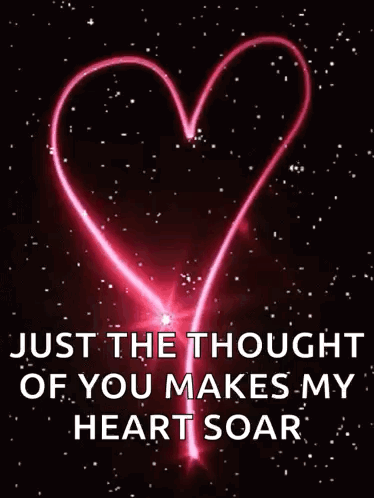 A Pink Heart Is Glowing In The Dark With The Words `` Just The Thought Of You Makes My Heart Soar '' . GIF