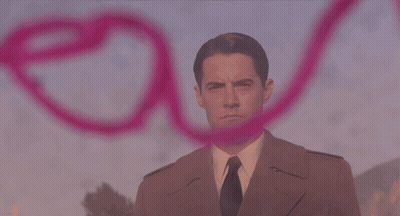 A Pink Heart Is Painted On A Wall With A Person Behind It GIF
