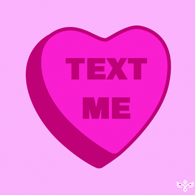 A Pink Heart Shaped Candy Says Text Me GIF