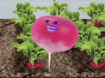 A Pink Radish With A Face On It Is Surrounded By Green Plants GIF